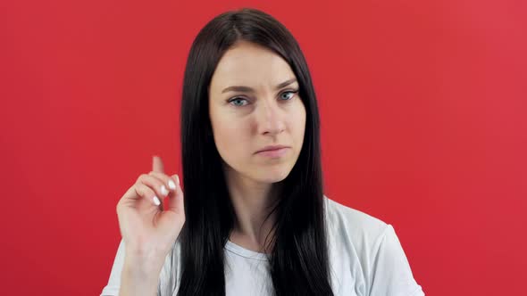 Brunette Woman Showing Signal Stop Gesture Crossed Hands Over Red Background