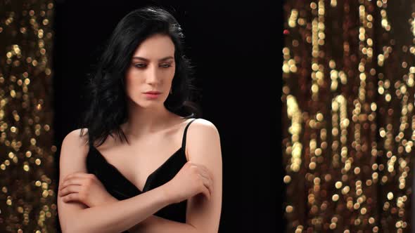 Fashion Woman Posing in Evening Black Dress Golden Sparkles