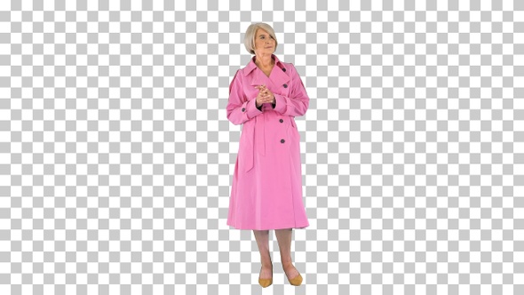 Smart lady in pink trench coat standing, Alpha Channel