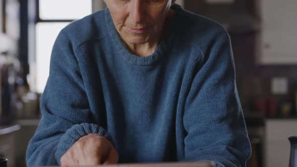 Senior woman relaxing alone at home