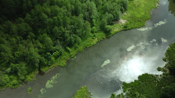 Flight Over The City Park. The River Is Visible. Aerial Photography From Above