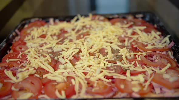Man Cook Pizza at Home, Sprinkle with Cheese, Homemade Food
