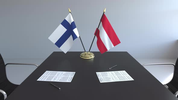 Flags of Finland and Austria on the Table