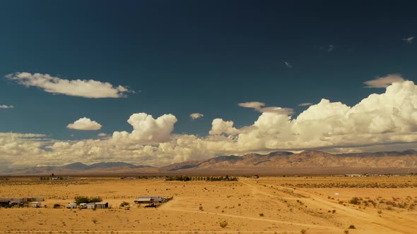 Aerial Hyper Lapse of clouds in the mojave desert