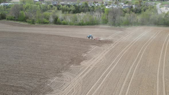 Mix of agriculture and residential development with woodlands, creek, and hills.