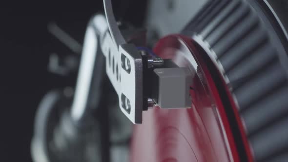 Vertical Video Pressing Play and Turning on the Turntable Player with Red Vinyl Record