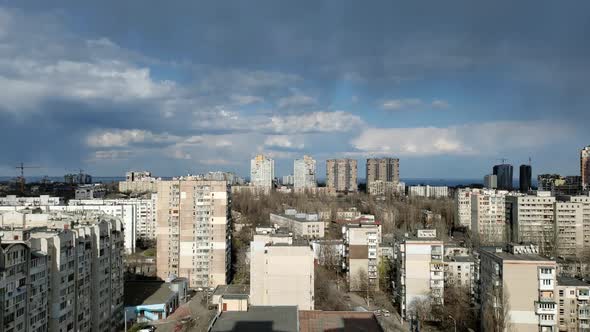 Time Lapse Aerial View of City Buildings and Clouds Fast Moving and Starting Rain