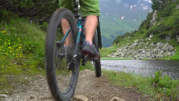 A mountain biker rides on a singletrack trail