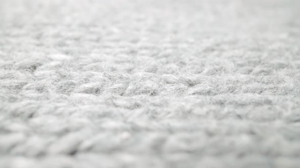Extreme Detail View of Sheep Wool Cloth Texture Flowing in Macro Dolly Shot