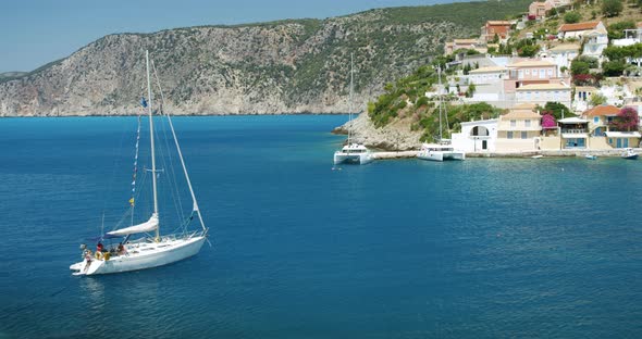 Greece Cephalonia Island Yacht Boat in Bay of Cute Assos Village on Summer Vacation