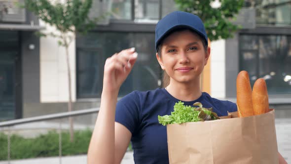 Portrait Smiling Food Delivery Woman Courier Holds Paper Bag with Groceries