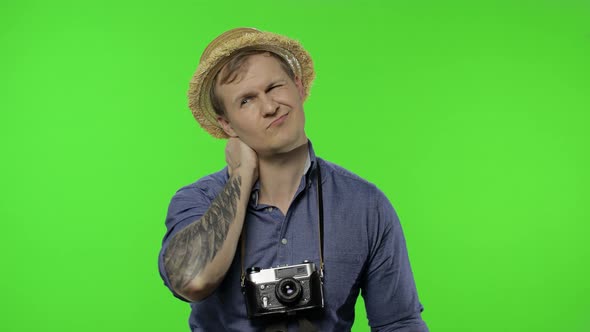 Portrait of Man Tourist Photographer Having Neck Pain, He Is Tired. Chroma Key