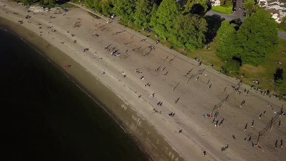 People Sunbathing On A Sunny Summer Day On Reopened Popular Kitsilano Beach In Vancouver, Lower Main