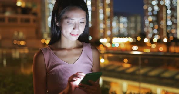 Woman use of cellphone at night 