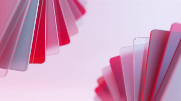 A Fan of Transparent Pink and Red Plastic Cards Unfolds