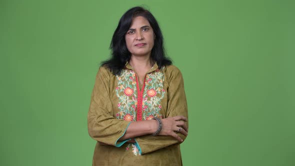 Mature Beautiful Indian Woman Wearing Traditional Clothes with Arms Crossed