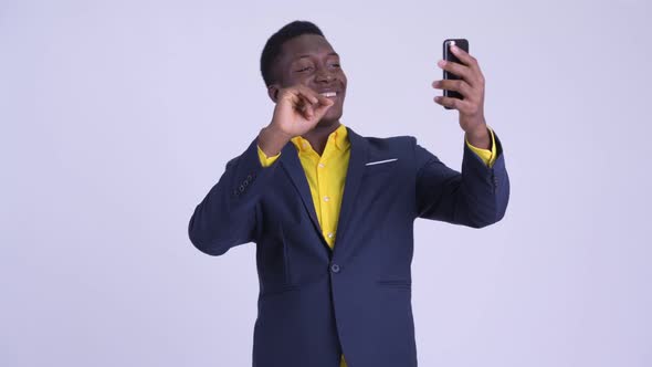 Young Happy African Businessman Video Calling with Phone