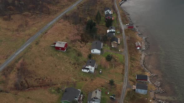 Drone Over Fishing Village And Road At Edge Of Fjord