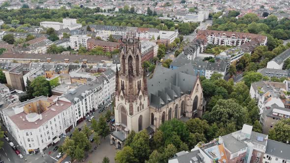 4k Aerial footage circling the historic Saint Martin Church building in Cologne, Germany.