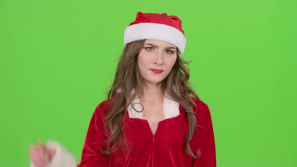 Santa Girl in Suit Shows Thumbs Down. Green Screen. Close Up. Slow Motion