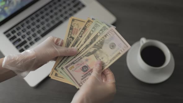 Female Hands with Dollar Banknotes