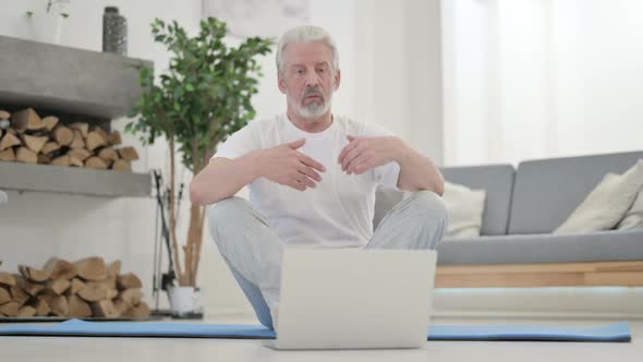 Old Man Talking on Video Call on Yoga Mat at Home