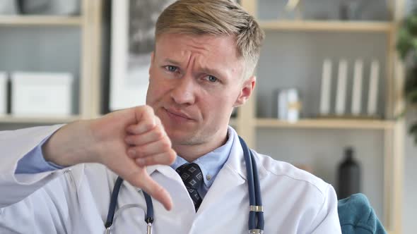 Thumbs Down By Upset Confident Doctor