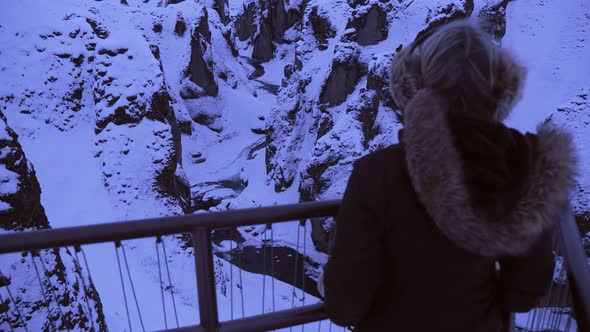 Iceland Winter View Of Tourist Looking Out At Large Snow Covered Valley In Winter At Sun Down 1