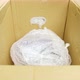 Closeup View of a Caucasian Man Packing Wrapped in Plastic Good - VideoHive Item for Sale
