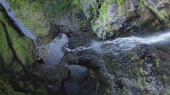 Aerial is turning clockwise above at Waterfall Risco, Madeira