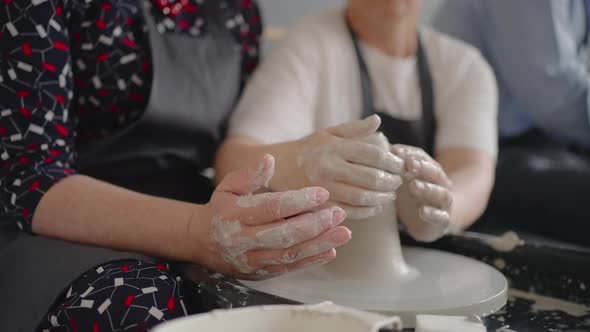 A Female Master Shares Her Skills While Giving a Lesson for the Elderly alt