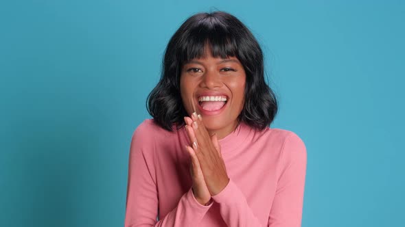 Young Woman Laughs Out Loudly Tries To Hide Emotions Covers Mouth