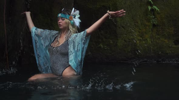 Shamanic Woman is Bathing in Forest