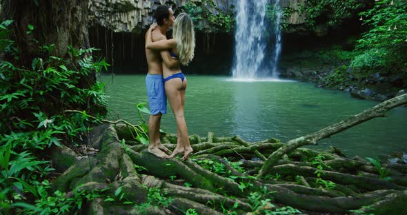 Couple Exploring Jungle Waterfall