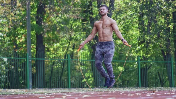 Fitness sportsman jumping with skipping rope. 