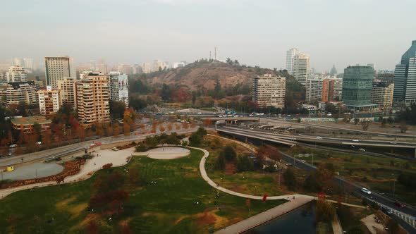 Aerial view of San Luis hill in Santiago city of Chile with daytime traffic on the road