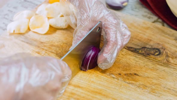 The Chef Cuts Red Onions Into Slices with a Professional Knife