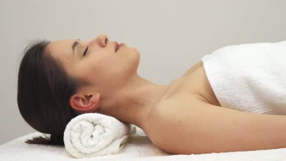 Girl Poses on the Massage Table