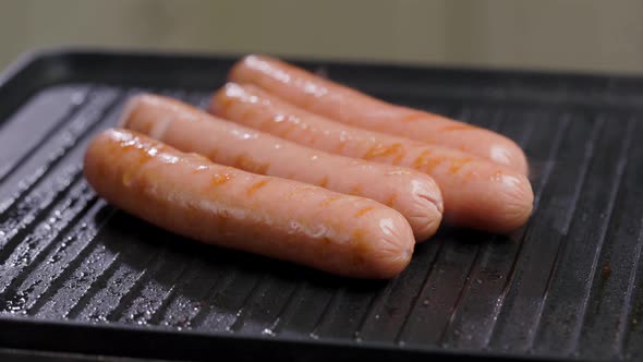 Meat Sausages Are Fried On Grill