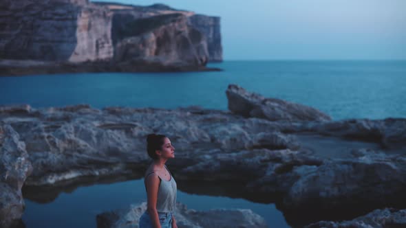 Young woman standing on the beach