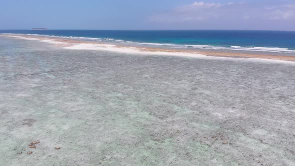 Ocean Coastline and Barrier Reef at Low Tide Zanzibar Matemwe Aerial View