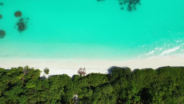 Aerial top down travel of beautiful resort beach lifestyle by blue lagoon with white sand background
