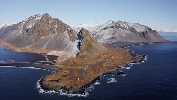 Drone Over Blue Sea Towards Coastline With Vestrahorn Mountain