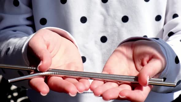 Slow Motion Woman Holding Reusable Metal Straw