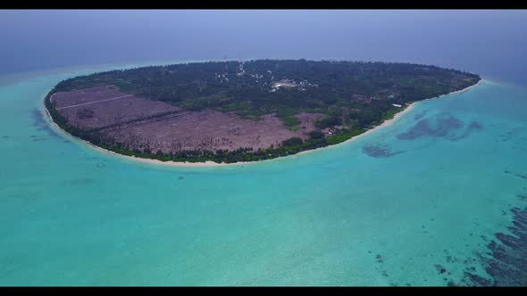 Aerial view scenery of idyllic tourist beach break by blue ocean and white sand background of a dayo