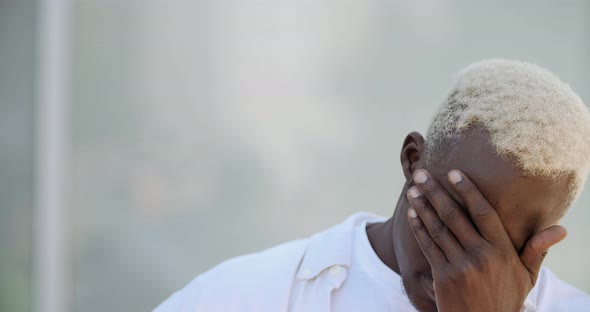 Close-up of Sad Male Face. Portrait of African American Guy Man Freelancer Student Traveler Feeling