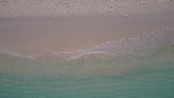 Drone aerial landscape of seashore beach by blue lagoon and sand background
