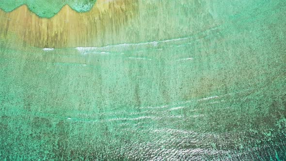 Luxury fly over island view of a sandy white paradise beach and blue sea background