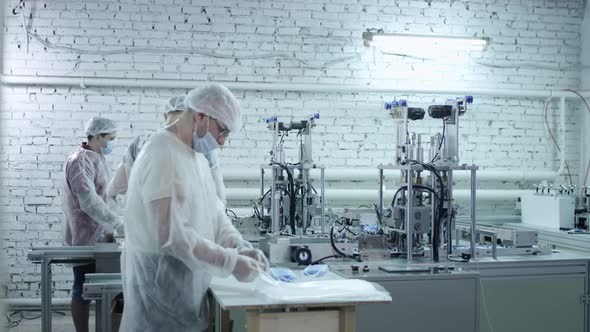 A Group of Workers From a Factory for the Production of Protective Medical Masks