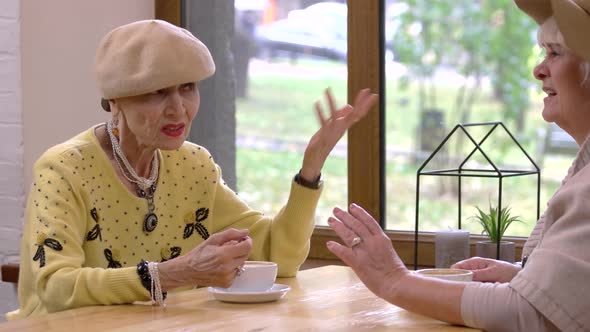 Two Women at Cafe Table